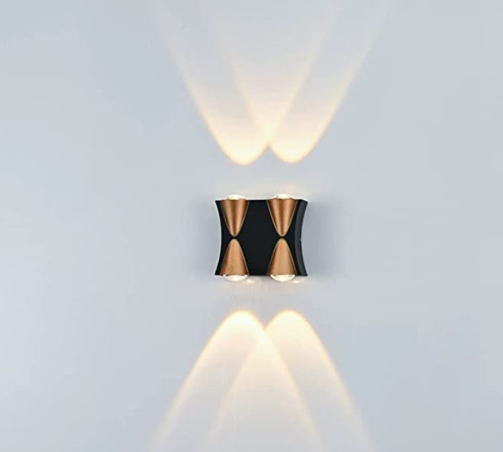 Amangazini 2 way wall sconce with modern design, casting warm light patterns on walls