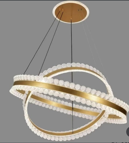 Modern chandelier with gold and white design on a gray background
