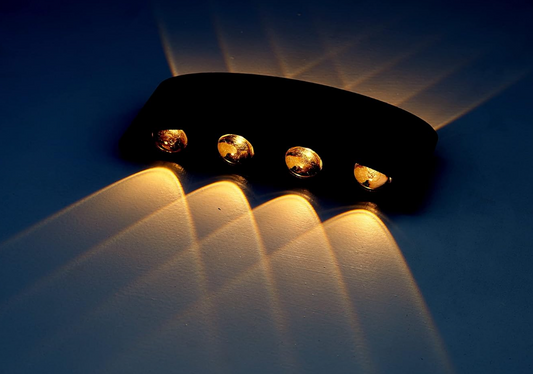 Amangazini 4 light wall fixture in sleek design showcasing warm light spread on the wall