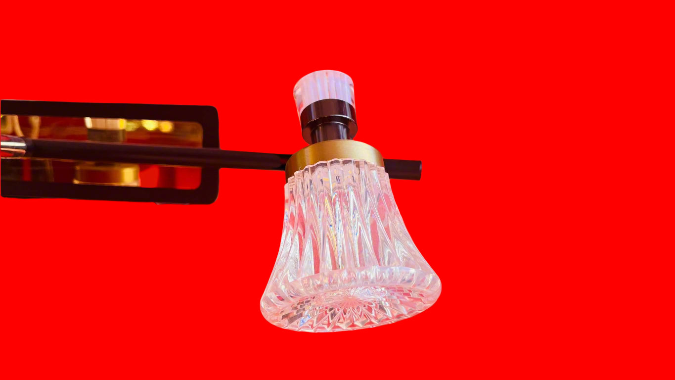 Decorative glass light fixture on a wall