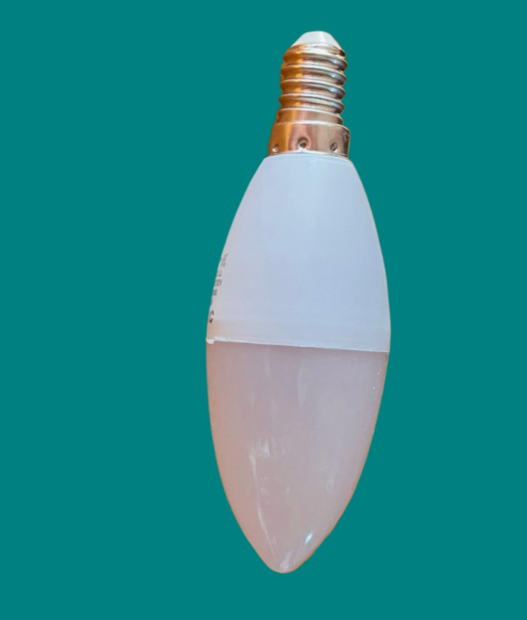 LED light bulb on a teal surface