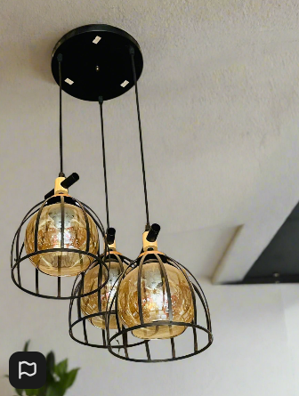 Amangazini Art Deco pendant light with three golden glass globes in modern cage design