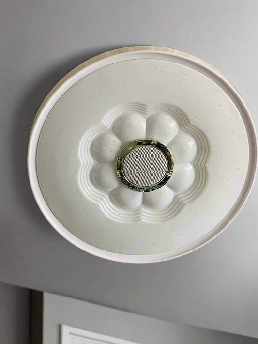 Amangazini Blossom audio ceiling light featuring a decorative floral design and integrated speaker