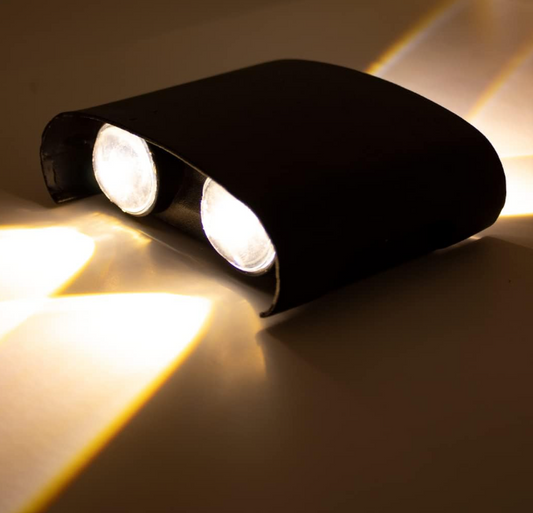 Amangazini dual LED wall sconce in sleek design providing warm ambient light for modern interiors