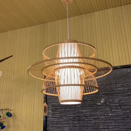 Stylish handmade bamboo pendant light featuring layered design and warm illumination for home decor