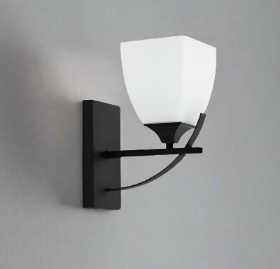 Matte Black & Frosted Glass Transitional Wall Sconce by Amangazini mounted on gray wall