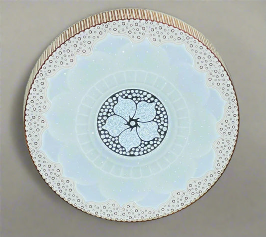 Elegant modern ceiling light with intricate floral design and soft glowing illumination