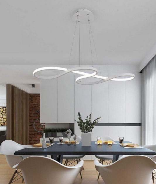 Modern Interlocking Ring LED Chandelier hanging above dining table in stylish white kitchen