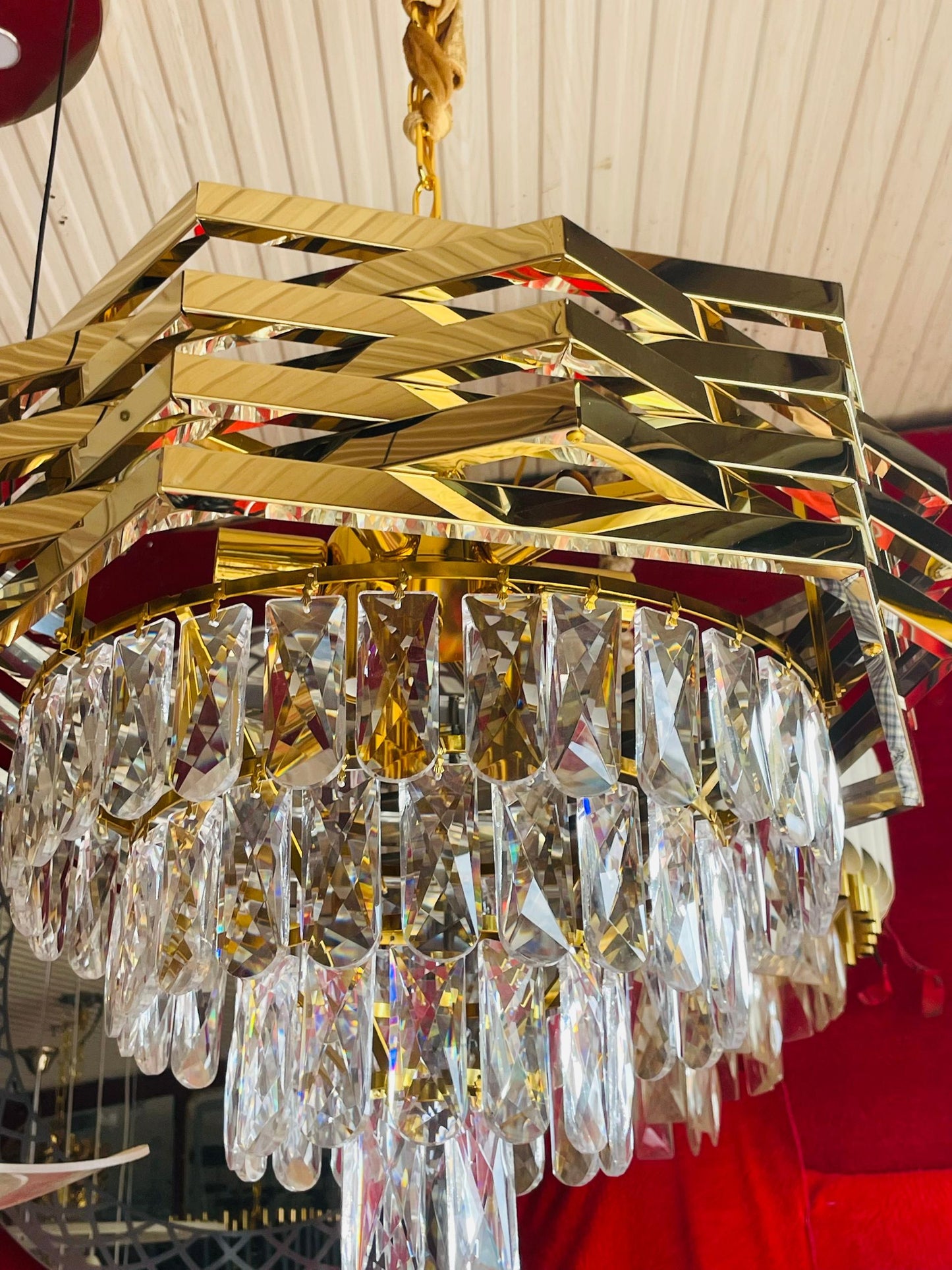 Amangazini modern opulence chandelier with gold geometric design and crystal accents