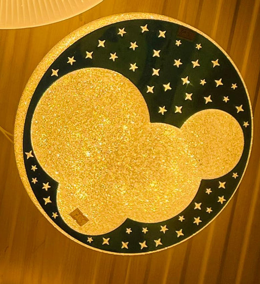 Starry blue cloud ceiling light with a glittery finish and decorative star patterns