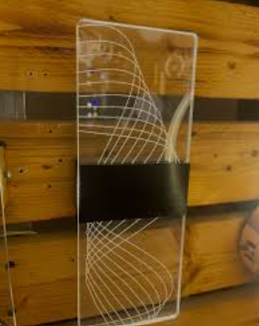 Amangazini swirl accent wall design featuring a modern geometric pattern on a clear panel