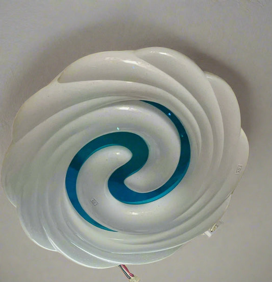 Teal swirl ceiling light featuring a modern design with a striking blue and white color contrast