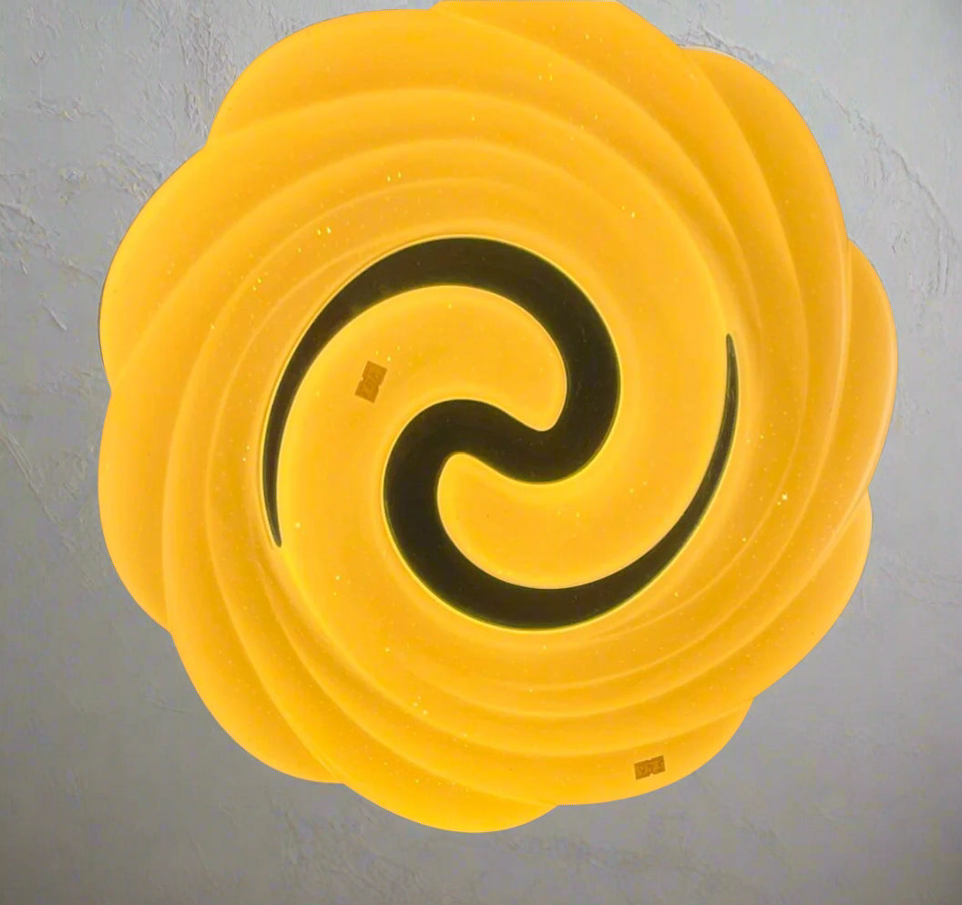 Teal swirl ceiling light featuring a unique circular design with a luminous glow