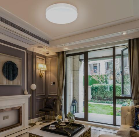 Modern living room with stylish ceiling flush mount lights illuminating the elegant interior design