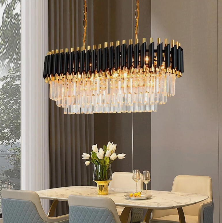 Elegant modern chandeliers featuring a striking design with glass and metal elements above a dining table