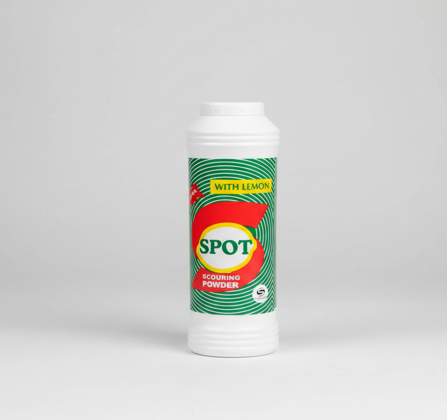 Spot scouring powder container with lemon flavor on a white background