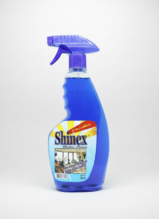 Blue spray bottle with a label on a white background