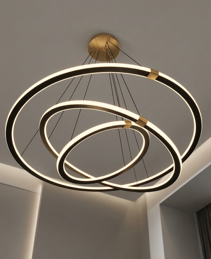 Modern chandelier with three circular rings on a neutral background
