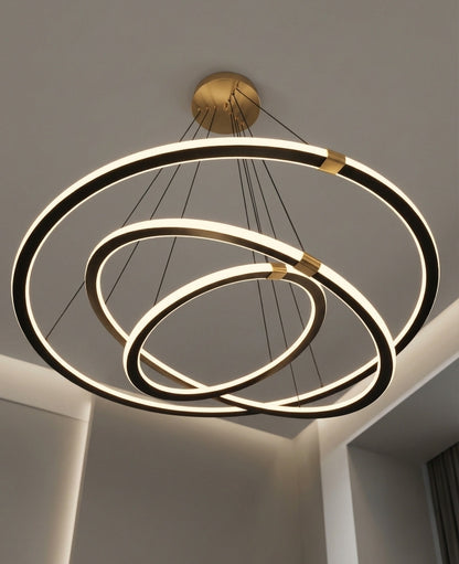 Modern chandelier with three circular rings on a neutral background