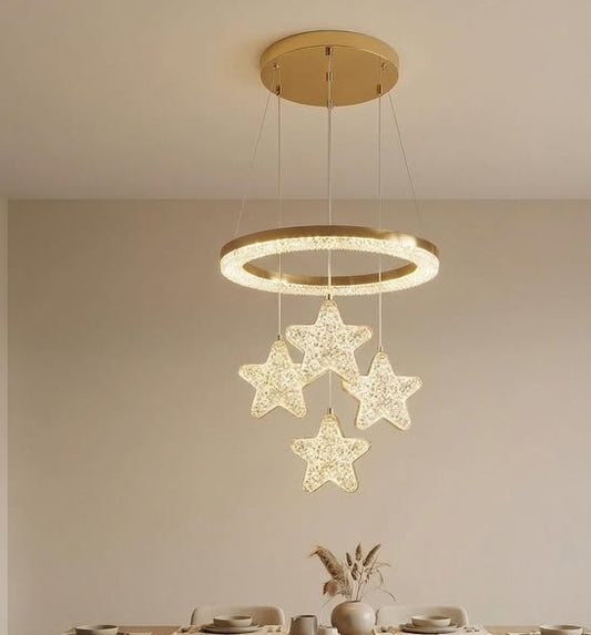 Chandelier with star-shaped crystals hanging above a dining table.