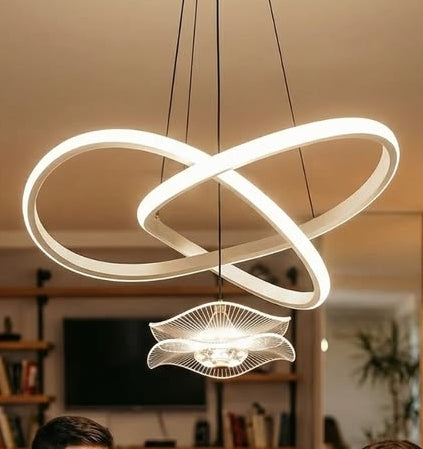 Modern pendant light fixture with circular design in a room setting.