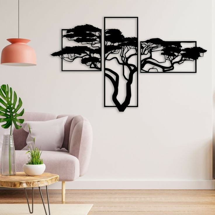 Modern living room with abstract black wall art on a white wall.