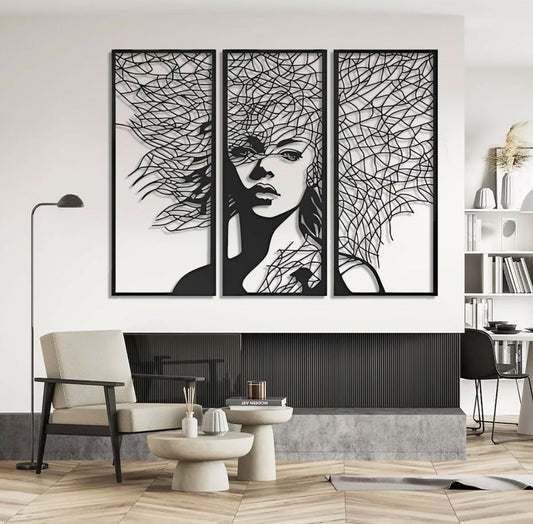 Modern interior with a triptych wall art piece of a stylized face.