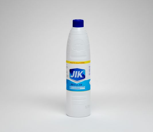 White bottle with blue cap and JIK label on a white background