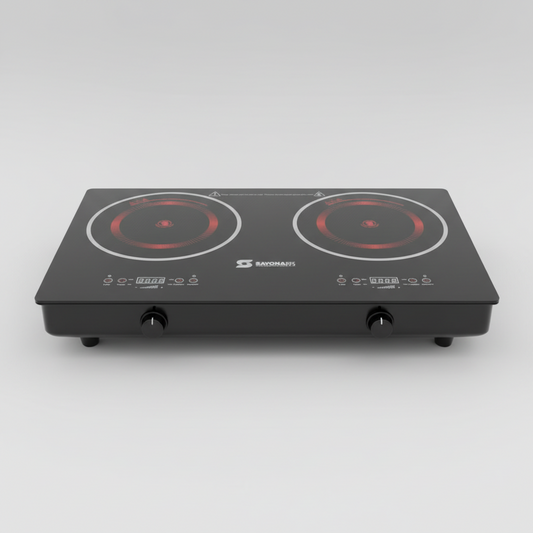 Double electric stove with red heating elements on a tiled floor