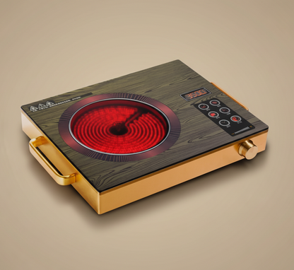 Portable electric stove with a glowing red heating element on a wooden table.