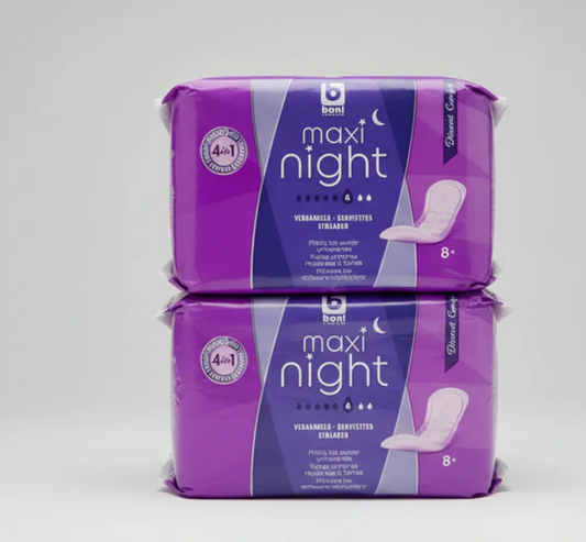 Two packages of Bion maxi night pads on a gray background
