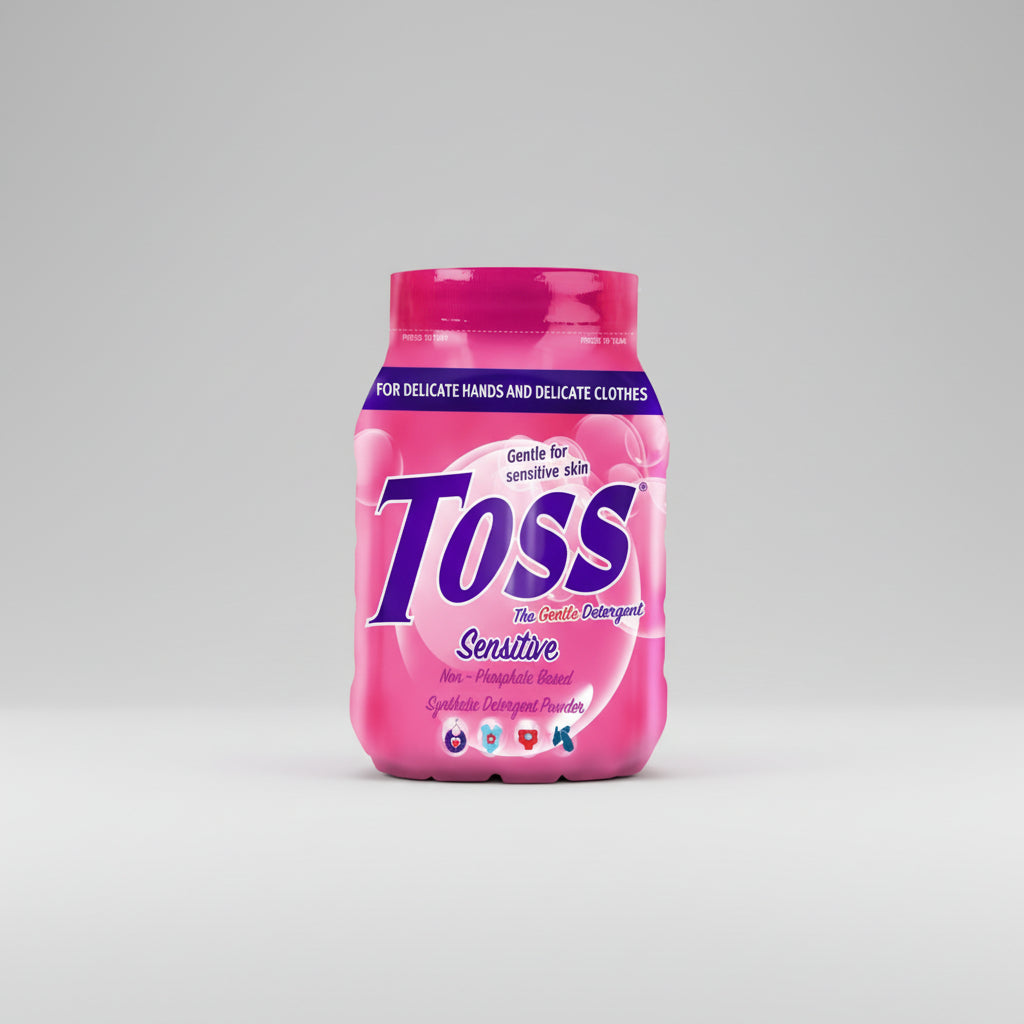 Pink container of Toss gentle detergent powder on a white background