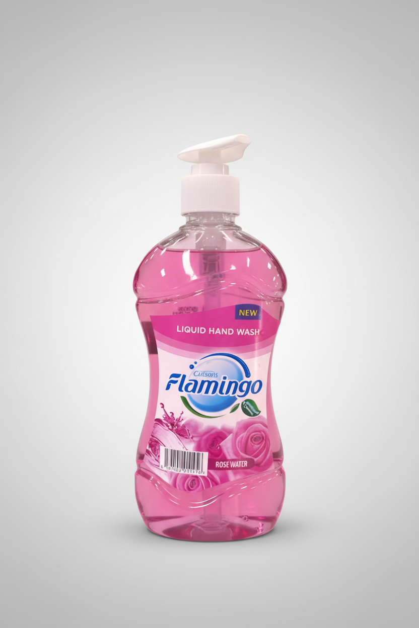 Pink bottle of Flamingo liquid hand wash on a wooden surface with a wooden background