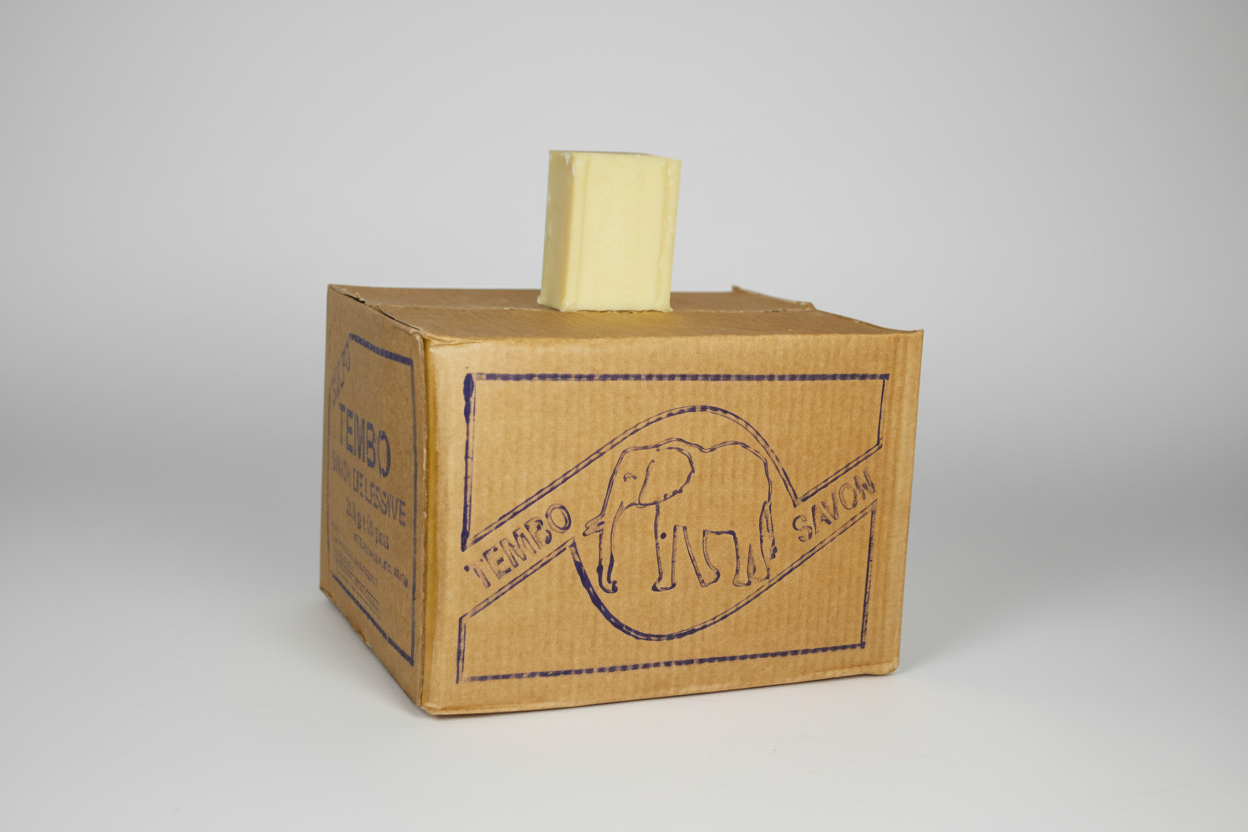 Cardboard box with a yellow block on top against a white background