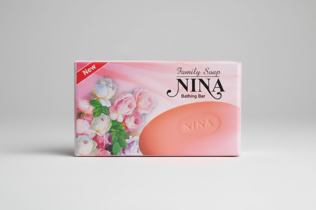 Nina soap bar with packaging featuring flowers and text on a blurred background