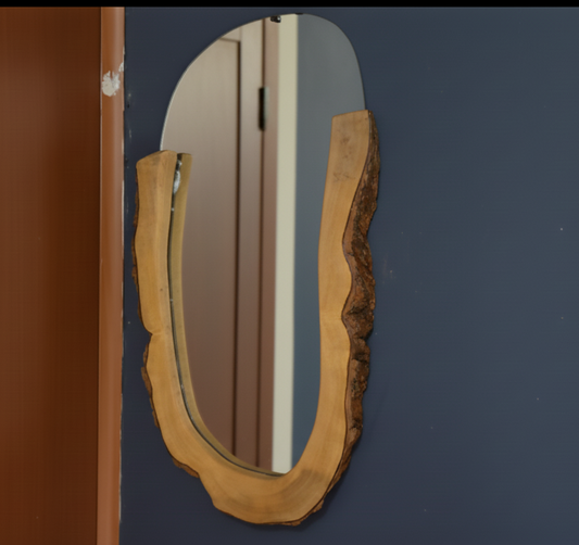 Wooden-framed mirror on a blue wall