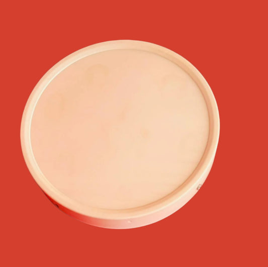 a white circular panel light object on teal the background.