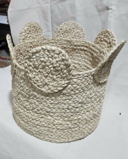 Woven basket with animal ears on a white background