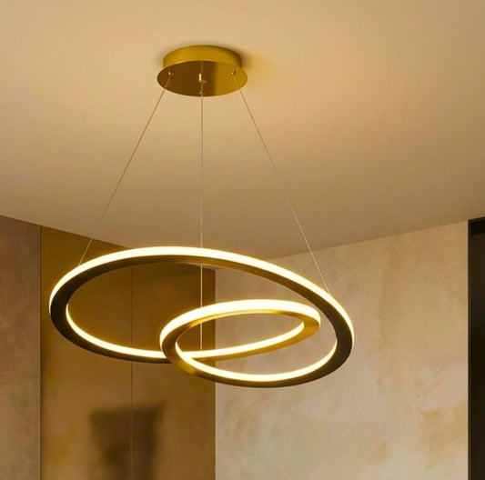 Modern ceiling light fixture with two interlocking rings on a neutral background