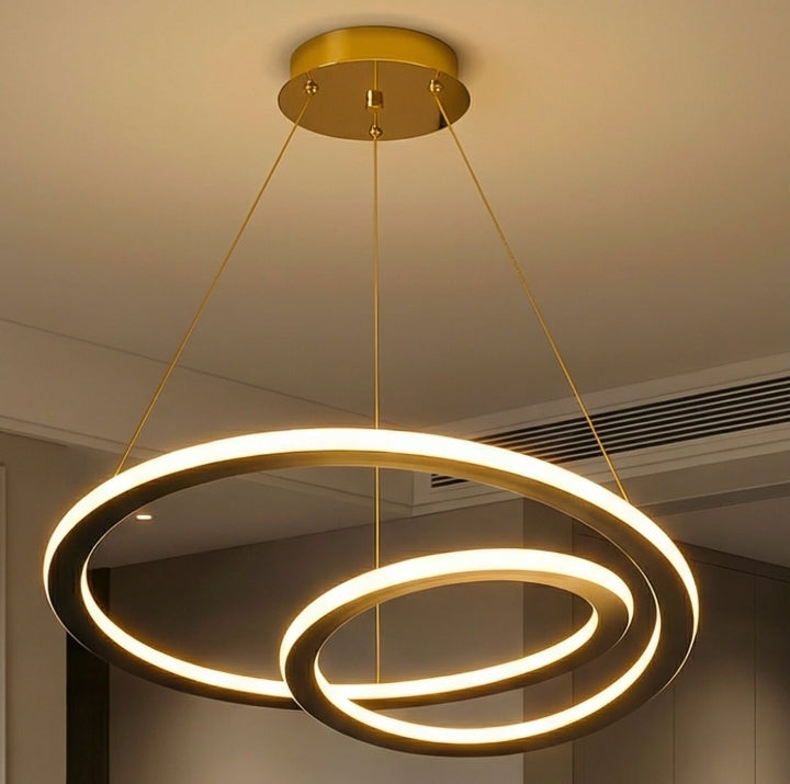 Modern chandelier with three circular rings hanging from the ceiling.