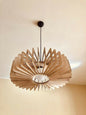 Modern pendant light with wooden design on a neutral background