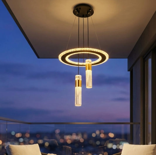 Modern pendant light fixture with a cityscape view at night