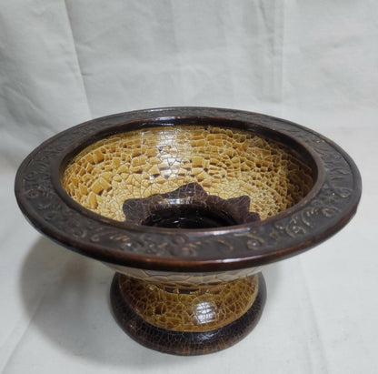 Ceramic bowl with textured interior and decorative exterior on a white background