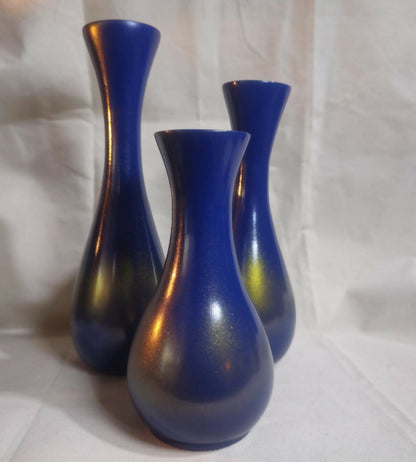Beautifully crafted wooden vase finished in striking blue and gold.