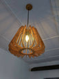 Wooden pendant light hanging from a ceiling