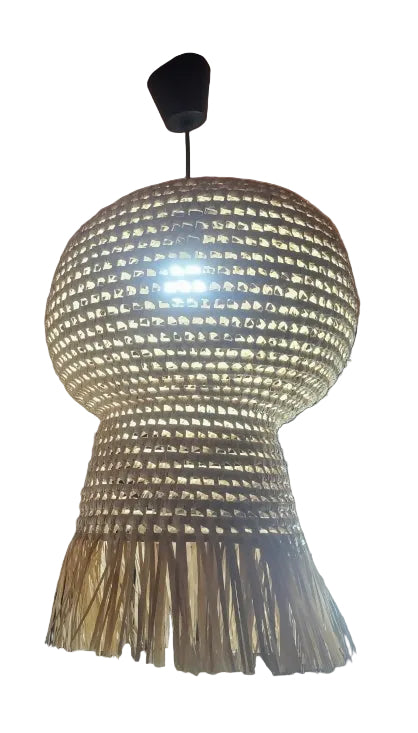 Woven light fixture hanging from a ceiling