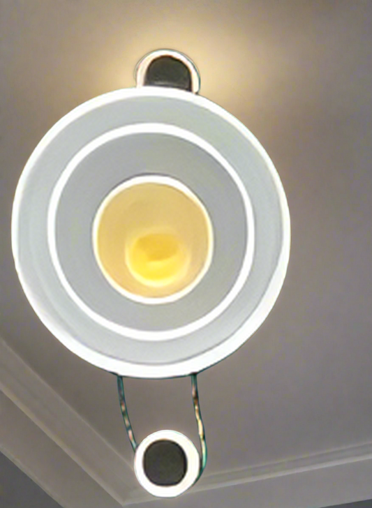 Amangazini AmberRing spotlight fixture with circular design and bright amber light element