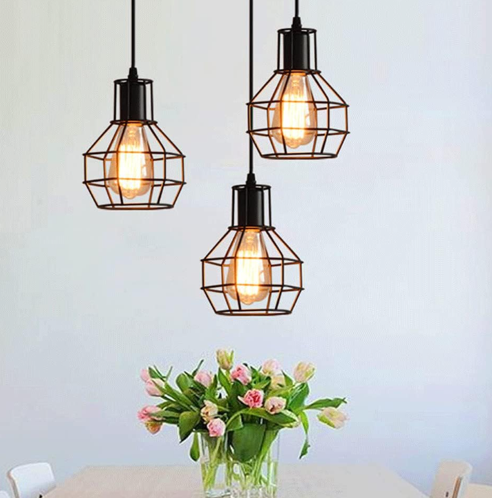 Amangazini Antique beauty cage pendant lighting with three stylish wire shades illuminating a dining area
