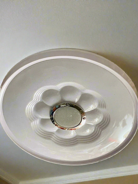 Blossom audio ceiling light in white with flower design and built-in speaker for modern interiors