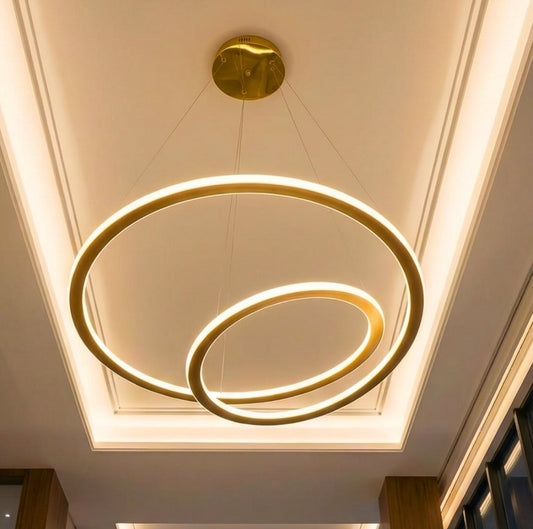Modern ceiling light fixture with three circular rings on a white ceiling.